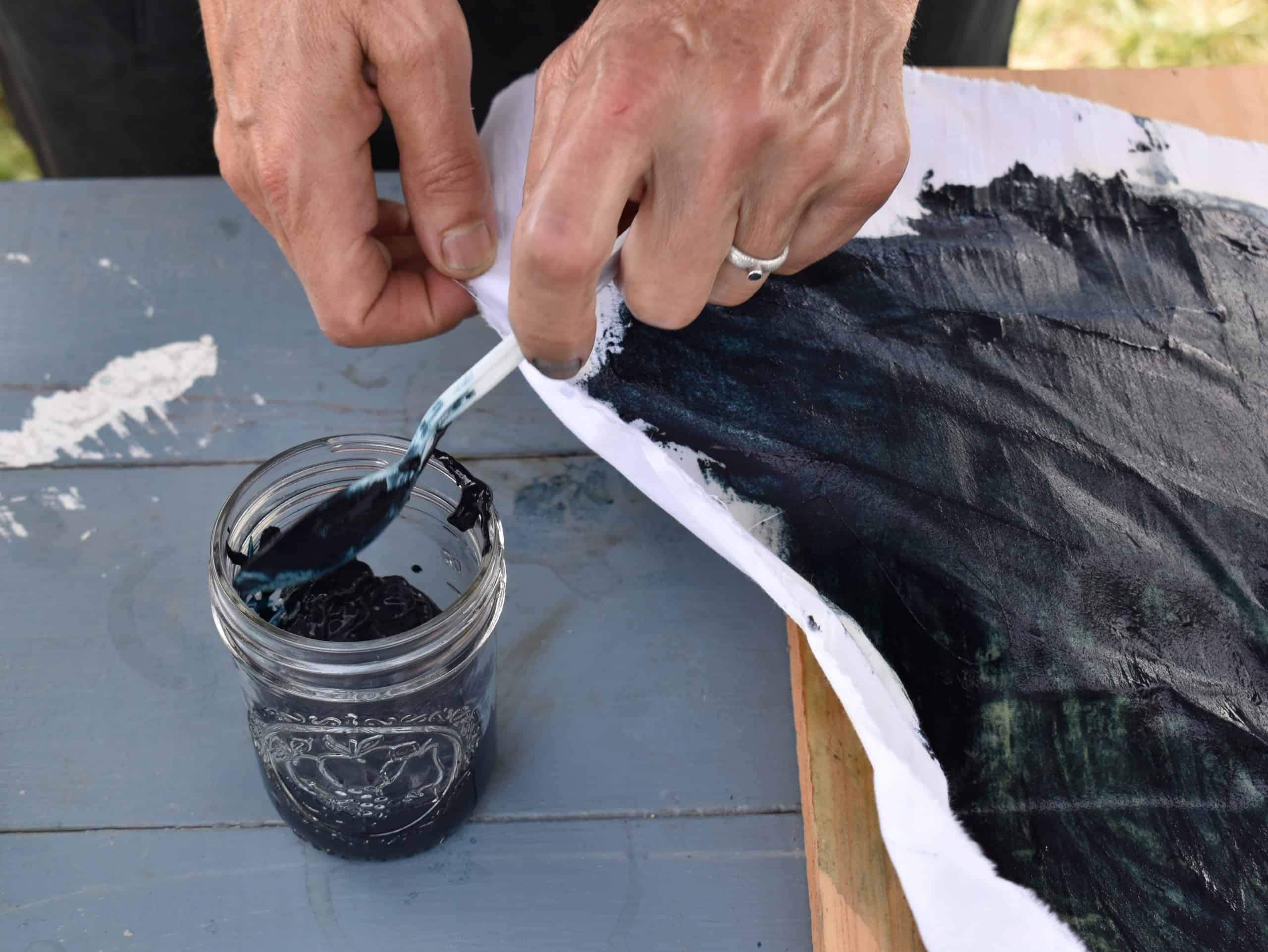 Edit_Sara Indigo CROP NOT PS_DSC_0389 Indigo pudding being removed from a straining cloth to a storage jar.